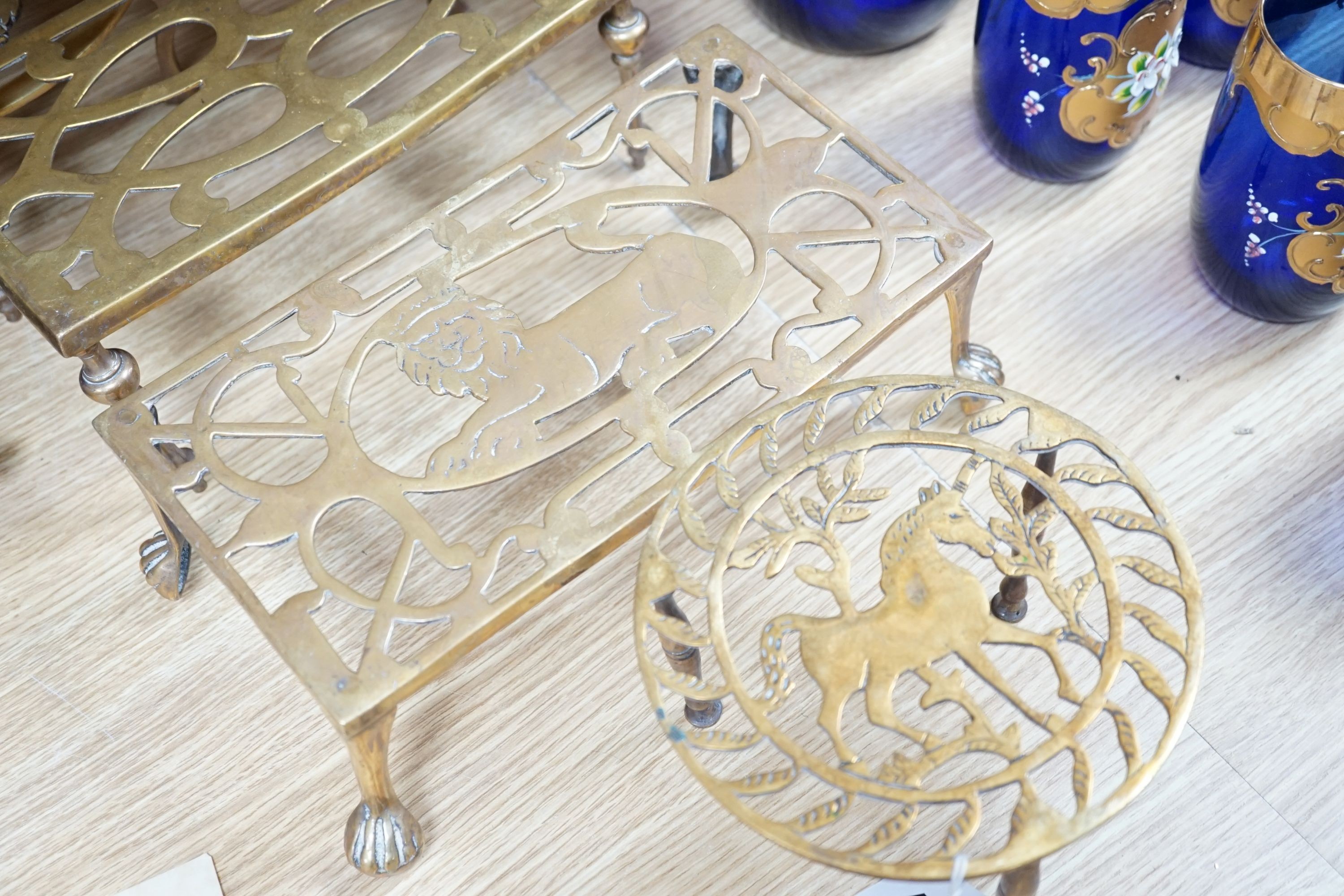 Assorted brass trivets and other brassware